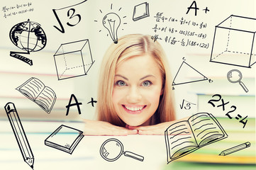 Fototapeta premium student with stack of books and doodles