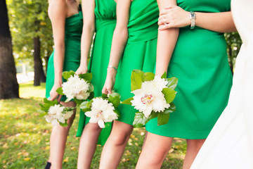 bridesmaids in identical green dresses