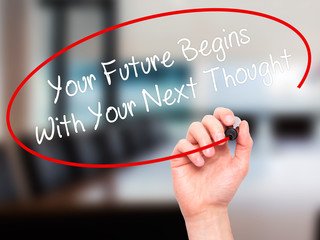 Man Hand writing Your Future Begins With Your Next Thought with