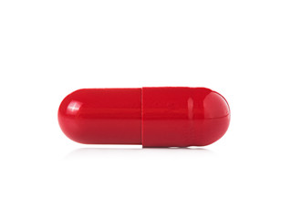 red pill capsules on white background