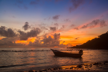 A boat in sea during sunrise