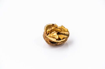 Cracked walnut on a white background.