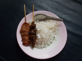 Cooked rice with grilled pork and liver.
