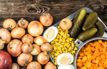 Food preparation. Vegetables for salad on wooden table.