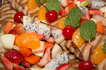 Pork Slide sauce topped with fruit