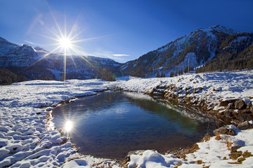 Doppelter Sonnenschein in einer Lacke auf der Gnadenalm