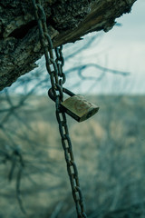 Locked padlock on a chain
