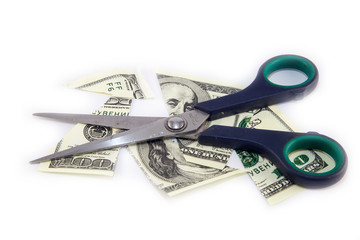 Dollars are cutting with scissors on a white background.