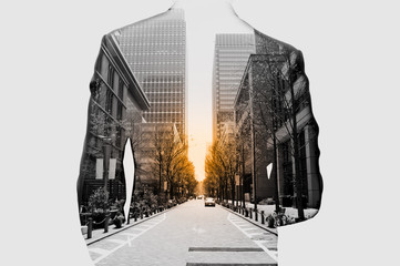 Double exposure of businessman in suit and cityscape. He's looking for his success in business and...