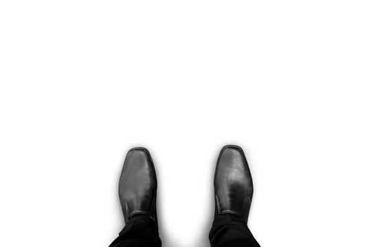 Black shoes standing on white floor