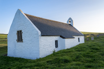 Fototapeta na wymiar Welsh chapel, located in Mwnt, on Cardigan coast, on a summers evening