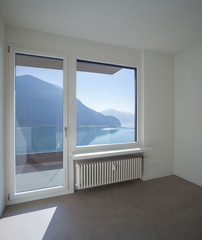 Empty room in modern house, lake view