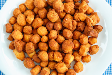 Cookies on a white plate and blue checkered tablecloths