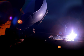 Fototapeta na wymiar Close-up of welder working in workshop.