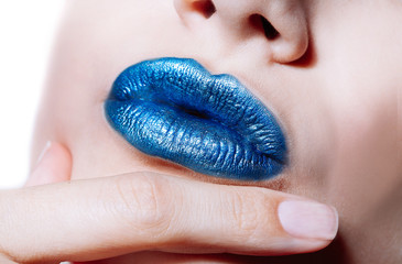Woman lips with glossy blue lipstick