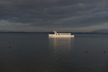 passenger boat at lake Chiemsee during sunset