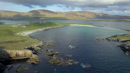 Dramatic aerial shot off the coast of Shetland, Scotland
