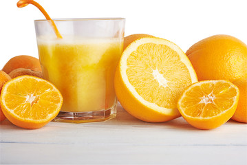 Orange juice with fruits. Close up.