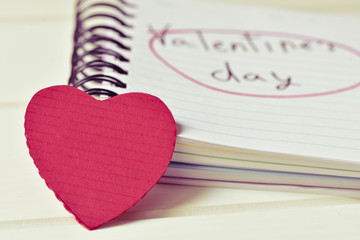 red heart and text valentines day in a notebook, filtered