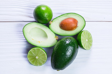 food background with fresh organic avocado on old wooden table