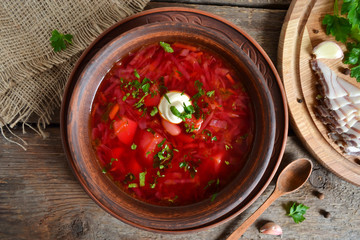 Traditional Ukrainian and Russian cuisine, soup cooked in meat broth with beets and tomatoes  