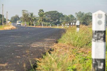 Country Road and pillar Through Farmland