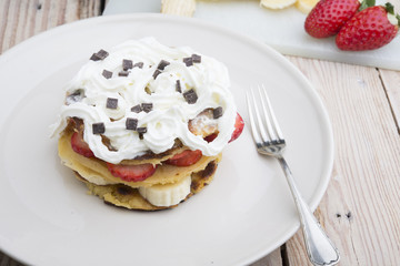 pancakes with strawberries, banana, blueberries and chocolate...