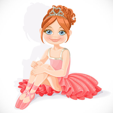 Beautiful little ballerina girl in pink dress sit on floor isola