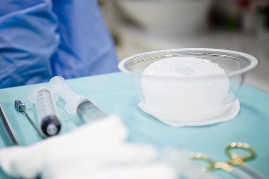 breast augmentation surgery in the operating room surgeon tools implant