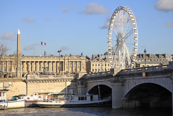 Fototapeta na wymiar PARIS, FRANCE -18 DECEMBER 2011: View from Quai d'Orsay at Pont de la Concorde and the Big ferris wheel, Paris, France