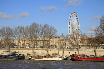 PARIS, FRANCE -18 DECEMBER 2011:  View from Quai d'Orsay at the Big ferris wheel, Paris, France