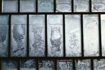 Vintage window frame with frozen ice figures