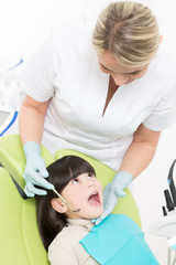 Fototapeta na wymiar Little girl at dentist's office