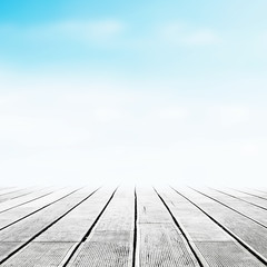 Wooden pier over blank blurred sky