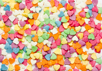 Sugar sprinkling hearts of different colors close-up