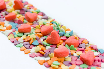 Building loving relationship: road paved sweets in the form of hearts. Love concept, space for text