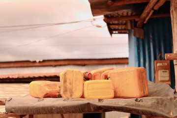 Fototapeta na wymiar Plastic jerrycans atop the roof. Kombolcha-Ethiopia. 0095
