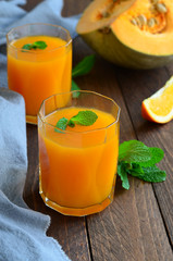 Pumpkin Orange Drink on wooden background
