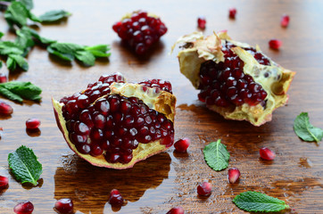 Pomegranate fruit on wooden background