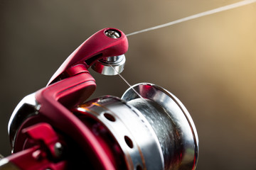fishing tackle on a wooden table. toned image
