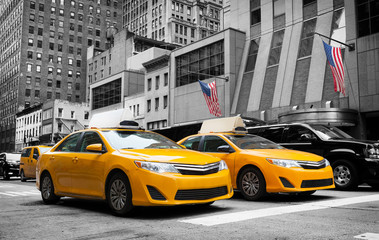 Classic street view of yellow cabs in New York city - obrazy, fototapety, plakaty