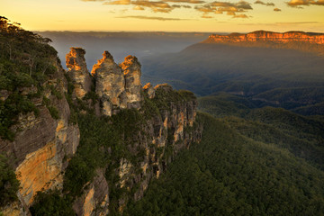 Sunrise in Blue Mountains. View over landmark rock formation "Three sisters"