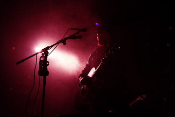 Guitarist plays on rock concert