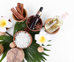 Beautiful spa setting on palm leaf, isolated on white