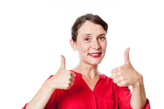 satisfaction concept - cheerful 30s woman with two thumbs up approving, congratulating for success, white background studio