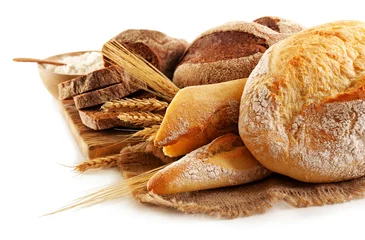 Gordijnen Fresh baked bread and wheat ears, isolated on white © Africa Studio