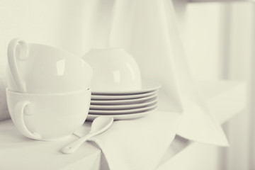 Tableware with napkin on a white background, close up