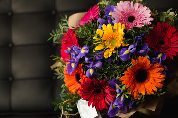 Flowers bouquet of gerber, iris, and pistachio