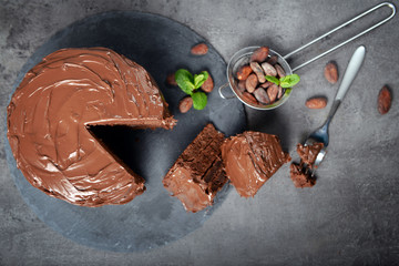 Chocolate pie with ingredients on table
