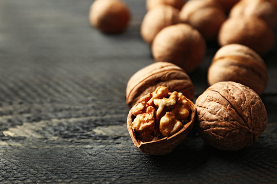 Walnuts on grey wooden table